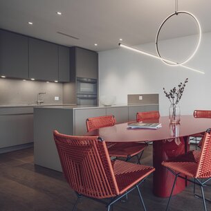 Renovated room at the Hotel National with a view of the kitchen | © Davos Klosters Mountains